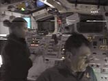 Американские астронавты с шаттла Discovery вышли в открытый космос Американские астронавты с шаттла Discovery вышли в открытый космос