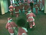 Видеокадры того, как хулиганы в красных колпачках и шубах накануне Рождества учинили дебош, уже облетели весь мир