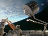 Американские астронавты начали на Международной космической станции сборку японского лабораторного модуля "Кибо", который станет самой крупной частью станции