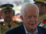 Экс-президент Джимми Картер приехал в гости к "Хамасу" и возложил венок к могиле Арафата