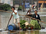 По предварительным данным, 55 человек погибли и семеро считаются пропавшими без вести в девяти китайских провинциях в результате наводнений, вызванных проливными дождями