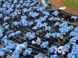 Организаторы Игр-2008 объявили вне закона солнечные зонтики