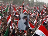 Собравшиеся выступают против долгосрочного соглашения о безопасности, которое юридически закрепит условия пребывания в Ираке войск США после окончания действия мандата ООН в декабре