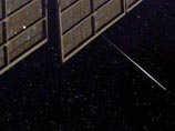 Фотография спутника Iridium, сделанная с МКС с марте 2003 года Фотография спутника Iridium, сделанная с МКС с марте 2003 года