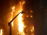 Пожар в 50-этажном жилом здании произошел в воскресенье в центре города Нанкин на востоке Китая