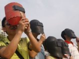 Сотни миллионов китайцев устремили сегодня глаза к небу, наблюдая солнечное затмение, самое продолжительное в нынешнем столетии