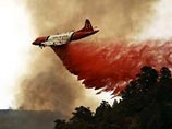 Пожарные постепенно берут под контроль лесные пожары у Лос-Анджелеса