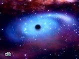 Астрономы обнаружили сверхмассивную "черную дыру" в центре далекой гигантской галактики