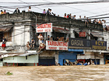 Число жертв сильнейшего за последние 20 лет наводнения на Филиппинах, вызванного тропическим штормом, увеличилось, по меньшей мере, до 72 человек