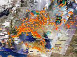 Около 400 "горячих точек" - очагов пожаров - увидели на западной части территории России в воскресенье инфракрасные сенсоры спутников NASA Terra и Aqua