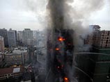 В Шанхае загорелась 28-этажная жилая высотка, в огне погибли по меньшей мере 12 человек, еще около сотни пострадали и размещены по больницам