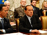 Муаммар Каддафи успокоил по телефону Сильвио Берлускони