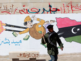 Бунтовщики в Ливии развлекаются карикатурами на Муаммара Каддафи