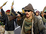 Представители ливийской оппозиции опровергли также сообщения о том, что правительственные войска взяли под контроль города Тобрук и Рас-Лануф