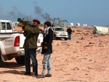 Каддафи развивает наступление на нефтяные центры и шлет народу торжествующие sms
