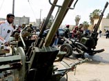 Война в Ливии грозит "вторым Ираком": Каддафи появился на ТВ непобежденным, а "Аль-Каида" грабит оружейные склады Война в Ливии грозит "вторым Ираком": Каддафи появился на ТВ непобежденным, а "Аль-Каида" грабит оружейные склады