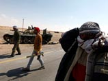 В минувшие сутки линия фронта, разделяющая верные Муаммару Каддафи регулярные войска и повстанцев, пролегала между городами Марса-эль-Брега и Адждабия