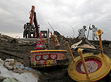 В развалинах вокруг "Фукусимы-1" ищут тела тысячи пропавших