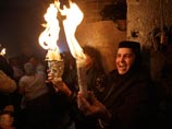 Благодатный огонь сошел в храме Гроба Господня в Иерусалиме, частицу пламени доставят спецрейсом в Москву
