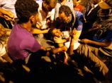 В результате ночных столкновений перед зданием МВД десятки человек получили ранения