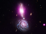 Специалисты NASA, работающие с орбитальными телескопами Hubble и Chandra, обнародовали снимок космического "восклицательного знака" из двух сливающихся галактик