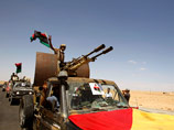 Двенадцать ливийских повстанцев погибли и еще несколько получили ранения в ходе боев с войсками ливийского лидера Муаммара Каддафи близ его родного города города Сирт