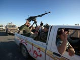 Новые власти Ливии воюют со сторонниками Каддафи, а в Бенгази прошел первый мирный марш протеста