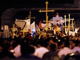 Власти утверждают, что беспорядки, в которых погибли десятки человек, были организованы христианами, напавшими на полицейских и солдат