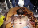 Тело Каддафи показали работающим в Ливии журналистам (ФОТО)