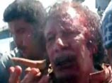 Муаммар Каддафи погиб не от ранения в голову, объявил врач. Перед смертью он увещевал: "Харам!"