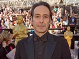 Кинокомпозитор года - автор саундтреков к фильмам "Гарри Поттер", "Король говорит" и "Древо жизни" Кинокомпозитор года - автор саундтреков к фильмам "Гарри Поттер", "Король говорит" и "Древо жизни"