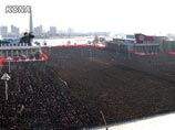 Траурные мероприятия, связанные с прощанием с Ким Чен Иром, завершились в четверг грандиозным митингом прощания с лидером КНДР на центральной площади имени Ким Ир Сена в Пхеньяне