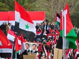 За 10 месяцев антиправительственных волнений Асад впервые появился на многолюдном митинге в столице. На площади также присутствовала его супруга Асма с двумя детьми