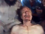 Спустя девять месяцев после убийства бывшего главы Джамахирии Муаммара Каддафи опубликовано очередное шокирующие видео, запечатлевшее то, каким изощренным издевательствам подвергли его тело победители-повстанцы