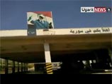 В интернете в четверг появился соответствующий видеоролик. На нем запечатлено, как повстанцы срывают портрет президента Сирии Башара Асада