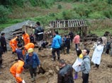 На юго-западе Китая 18 школьников погибли, оказавшись блокированными под завалами здания школы, разрушенного в результате схода оползня