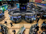 В среду возобновили работу фондовая биржа Нью-Йорка и электронная биржа NASDAQ, которые накануне шторма "Сэнди" закрывались впервые за четверть века