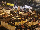 В центре столицы Греции, несмотря на дождь, в среду собралась многотысячная толпа, протестующая против голосования в обнесенном баррикадами парламенте по правительственному законопроекту о мерам жесткой экономии и структурным реформам