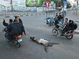 ФОТО из Газы: казнив шестерых "израильских шпионов", байкеры протащили труп по городу