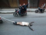 "Шпион", чей труп протащили за мотоциклом по улицам Газы, погиб ни за что, объявила его вдова