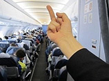 Авиакомпания "Аэрофлот" уволила бортпроводницу, выложившую на своей страничке "Вконтакте" фотографию, на которой на фоне сидящих спиной пассажиров самолета изображена женская рука с поднятым средним пальцем