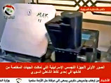 Сирийское государственное телевидение показало в эфире находку - камеру, спутниковую антенну, аккумуляторы, кабели и другие приспособления
