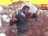 Видеопропаганда из Сирии: повстанец-каннибал вырезает у солдата сердце и ест Видеопропаганда из Сирии: повстанец-каннибал вырезает у солдата сердце и ест