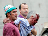 Машинист Хосе Гарсон(на фото - в центре) после трагического ЧП находился в больнице, у его палаты был выставлен полицейский караул