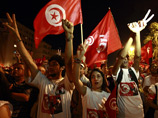 Тунис переживает политический кризис с июля этого года - тогда в стране был убит один из лидеров оппозиционного движения