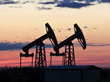 Холдингу "Роснефтегазу" в ближайшее время придется перечислить в бюджет 4,9 млрд долларов от продажи BP 5,66% "Роснефти"
