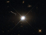 Телескоп Hubble сделал фотографию одного из ближайших к Земле квазаров - мощного активного ядра эллиптической галактики в созвездии Девы. Квазар под названием 3C 273 был открыт первым из всех квазаров в начале 1960-х годов Телескоп Hubble сделал фотографию одного из ближайших к Земле квазаров - мощного активного ядра эллиптической галактики в созвездии Девы. Квазар под названием 3C 273 был открыт первым из всех квазаров в начале 1960-х годов