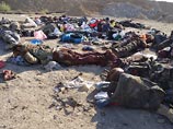 В сирийском городе Адра, в 20 км к северо-востоку от Дамаска, боевики казнили около 90 пленников, которые использовались в качестве живого щита В сирийском городе Адра, в 20 км к северо-востоку от Дамаска, боевики казнили около 90 пленников, которые использовались в качестве живого щита