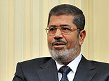 Экс-президента Египта Мурси будут судить за оскорбление судей и давление на суд