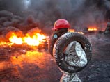 В ЕС назвали "прагматичным" решение Януковича остановить евроинтеграцию. В Киеве пожары и новые слухи о введении ЧП